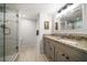 Bathroom featuring a glass-enclosed shower and a vanity with granite countertops at 1480 Gulf Blvd # 401, Clearwater Beach, FL 33767