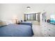 Bedroom with two beds and natural light at 1480 Gulf Blvd # 401, Clearwater Beach, FL 33767