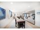 Spacious dining area features a modern table and chairs, with views of the ocean and living area at 1480 Gulf Blvd # 401, Clearwater Beach, FL 33767