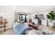 Inviting living room showcasing a comfortable sofa, large TV, and a balcony overlooking the ocean at 1480 Gulf Blvd # 401, Clearwater Beach, FL 33767