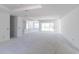 Spacious living room under construction featuring recessed lighting and sliding glass doors to the patio at 15513 Aldama Cir, Port Charlotte, FL 33981