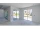 Unfinished living room featuring sliding glass doors, with natural sunlight at 15513 Aldama Cir, Port Charlotte, FL 33981