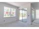 Bright, unfinished room with a large window and sliding glass doors, awaiting personalization at 15513 Aldama Cir, Port Charlotte, FL 33981