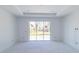 Spacious living room featuring recessed lighting and sliding glass doors offering backyard views at 15513 Aldama Cir, Port Charlotte, FL 33981