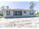 New construction home featuring large windows and sliding glass doors for plenty of natural light at 15513 Aldama Cir, Port Charlotte, FL 33981