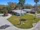 Aerial view of the property showcasing its well-manicured lawn and prime location on a corner lot at 1600 Delaware Ne Ave, St Petersburg, FL 33703