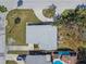 Bird's-eye view of the house, highlighting the roof, backyard with landscaping, and surrounding neighborhood at 1600 Delaware Ne Ave, St Petersburg, FL 33703