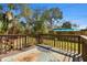 Spacious backyard with a wooden deck, vibrant rug, and tranquil outdoor setting at 1600 Delaware Ne Ave, St Petersburg, FL 33703