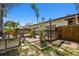 Charming backyard deck area with a mix of lounge seating, potted plants, and stylish accents at 1600 Delaware Ne Ave, St Petersburg, FL 33703