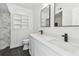 Modern bathroom featuring double sinks, waterfall faucets, elegant mirrors, and a tiled shower at 1600 Delaware Ne Ave, St Petersburg, FL 33703