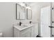Bright bathroom featuring double sinks, modern faucets, and elegant mirrors at 1600 Delaware Ne Ave, St Petersburg, FL 33703