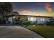 Inviting exterior showcasing well-maintained lawn, modern design elements, stone facade and charming curb appeal at 1600 Delaware Ne Ave, St Petersburg, FL 33703