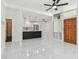 Bright and spacious living area open to the modern kitchen, featuring stylish tile floors at 1600 Delaware Ne Ave, St Petersburg, FL 33703