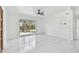 Light filled living room with tile flooring, a large sliding door, and a view of the outdoor deck at 1600 Delaware Ne Ave, St Petersburg, FL 33703