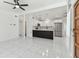 Spacious living area with tile floors, an open layout, and views into the kitchen at 1600 Delaware Ne Ave, St Petersburg, FL 33703