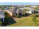 Expansive backyard featuring a manicured lawn, screened lanai, and lush landscaping for outdoor enjoyment at 17533 Timberline Pkwy, Punta Gorda, FL 33982