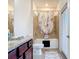 Bathroom featuring granite countertops, tiled shower, and a tub with a curtain at 17533 Timberline Pkwy, Punta Gorda, FL 33982