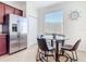 Breakfast nook with lots of natural light and stainless steel refrigerator at 17533 Timberline Pkwy, Punta Gorda, FL 33982