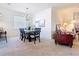Elegant dining room featuring a modern chandelier and comfortable seating for six at 17533 Timberline Pkwy, Punta Gorda, FL 33982
