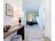 Bright entryway with a view into the living room, showcasing neutral tones, stylish furnishings, and an open floor plan at 17533 Timberline Pkwy, Punta Gorda, FL 33982