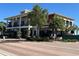 Two story building with a restaurant, Slaters, and shops on the first floor and palm trees outside at 17533 Timberline Pkwy, Punta Gorda, FL 33982