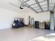Spacious two car garage with epoxy floor coating and golf cart parking at 17533 Timberline Pkwy, Punta Gorda, FL 33982