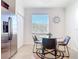 Bright breakfast nook features a stainless steel refrigerator, tile floors and large window at 17533 Timberline Pkwy, Punta Gorda, FL 33982