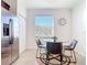 Eat-in kitchen with a glass table, seating for four, stainless steel appliances, and ample natural light at 17533 Timberline Pkwy, Punta Gorda, FL 33982
