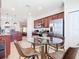 Eat-in kitchen with a glass table, seating for four, stainless steel appliances, and ample cabinets at 17533 Timberline Pkwy, Punta Gorda, FL 33982