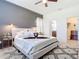 Cozy bedroom featuring a comfortable bed, stylish decor, and convenient access to the ensuite bathroom and closet at 17533 Timberline Pkwy, Punta Gorda, FL 33982