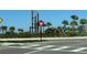 Community entrance featuring native landscaping and the neighborhood's signature logo on a clear, sunny day at 17533 Timberline Pkwy, Punta Gorda, FL 33982