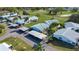 Aerial view of community homes, showing carports, lawns and landscaping at 1902 Andover St # 198, Sun City Center, FL 33573