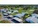 Aerial view of community homes with carports, lawns and green spaces at 1902 Andover St # 198, Sun City Center, FL 33573