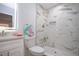 Modern bathroom featuring a marble tiled shower, LED mirror, and stylish vanity for a spa-like experience at 1902 Andover St # 198, Sun City Center, FL 33573