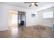 Bright bedroom with lovely hard wood flooring and a ceiling fan plus access to outdoor living space at 1902 Andover St # 198, Sun City Center, FL 33573