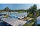 Exterior of home, featuring lush landscaping and nearby covered parking at 1902 Andover St # 198, Sun City Center, FL 33573