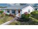 Charming single story home with well-maintained landscaping and peach accents at 1902 Andover St # 198, Sun City Center, FL 33573