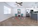 Bright living space featuring modern kitchen, hardwood floors, and seating area at 1902 Andover St # 198, Sun City Center, FL 33573