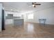 The open floor plan features modern appliances, wood-look floors, and an airy, bright space at 1902 Andover St # 198, Sun City Center, FL 33573