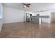 Open-concept living area showcasing wood floors and a modern kitchen with stainless steel appliances at 1902 Andover St # 198, Sun City Center, FL 33573