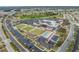 Aerial view of community center, lawns, pool and parking at 2335 E Del Webb Blvd, Sun City Center, FL 33573