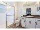 Bathroom featuring a glass enclosed shower and white cabinets at 2335 E Del Webb Blvd, Sun City Center, FL 33573