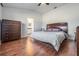 Cozy bedroom with a large bed and wooden dresser at 2335 E Del Webb Blvd, Sun City Center, FL 33573