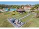 Aerial view of bocce ball court and gazebo with tables for relaxing near the community pool at 2335 E Del Webb Blvd, Sun City Center, FL 33573