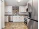 Well-lit kitchen with stainless steel appliances at 2335 E Del Webb Blvd, Sun City Center, FL 33573