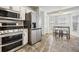 Bright kitchen with stainless steel appliances and tile floors at 2335 E Del Webb Blvd, Sun City Center, FL 33573