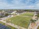 Aerial view of a community lawn bowling area with manicured greens and flags at 2335 E Del Webb Blvd, Sun City Center, FL 33573