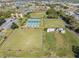 An aerial view of community lawn bowling lawns with spectator seating at 2335 E Del Webb Blvd, Sun City Center, FL 33573