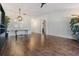 Spacious living room with wood floors and bright light fixtures at 2335 E Del Webb Blvd, Sun City Center, FL 33573