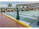 Covered shuffleboard courts with benches and shade at 2335 E Del Webb Blvd, Sun City Center, FL 33573